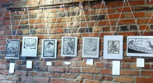Prints on the wall at Solstice.
